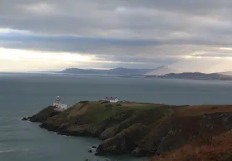 Sunlight breaks over the coastal town of Howth