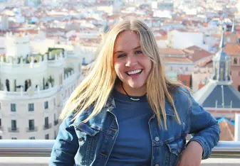 On top of a building in Madrid. Looking at the whole city with a huge smile on my face!