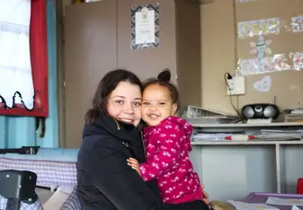 Baby girl and volunteer 
