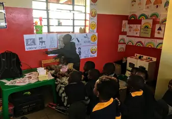 Photo of student teaching his peers