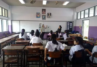 Nayley teaching with thai school