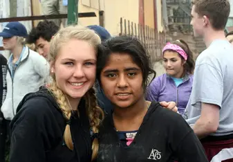 Two girls posing for a photo.