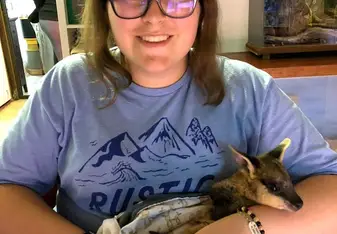 Me bottle feeding a Wallaby joey