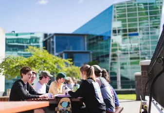 Students on campus outside a cafe