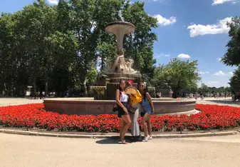 Two friends and I in front of a fountain in Buen Retiro Park, Madrid