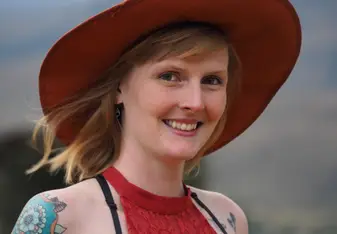 A woman wearing a hat.