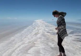 A woman at a sandbar.