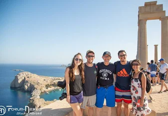 A group photo at a tourist spot.