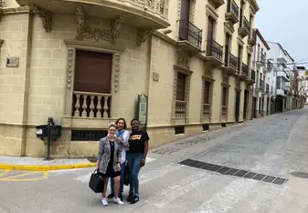 Three women at an alley.