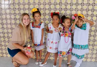 A woman and four little girls.