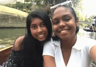 Two women taking a selfie on a punt.