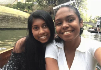 Two women taking a selfie on a punt.