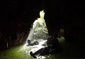 People inside a cave.