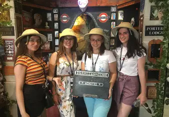 Group of girls inside an escape room.