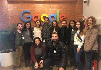 group of participants in front of google sign 