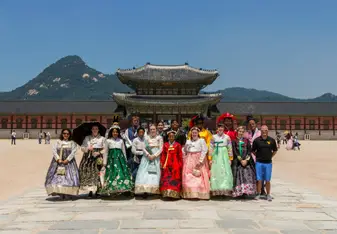 Exploring the Gyeongbokgung Palace in Seoul dressed in Hanbok