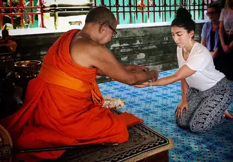 receiving a blessing from a monk at Wat Arun in bangkok!