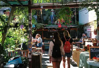 This is the Szimpla Kert ruin bar, which becomes a market on Sundays. It was the first "ruin bar" which is a building that was damaged in WWII and has been turned into a bar or restaurant.