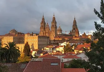 Santiago de Compostela cityscape with dark clouds