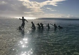 With the help of a local Fijian, we dragged a fallen palm tree out to sea and set sail on our makeshift boat