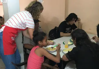 Serving meals to the people in the neighbourhood