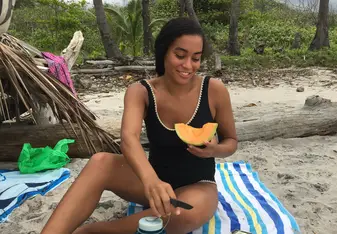 This is me living my best life, eating fresh fruit in Santa Theresa.