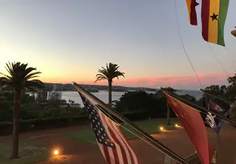View from the porch of ICMS looking out over Manly beach at sunset.