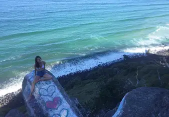 This photo was taken at Cock Rock in Burleigh Heads in Gold Coast Australia. It is a rock formation that juts out of the side of cliff and provides an amazing view of the Gold Coast coastline. 