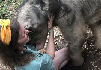 Bathing with baby elephants.