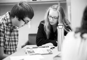 Girl is teaching the guy