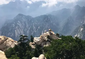 The famed Chess Pavilion on Huashan Mountain in Shaanxi province of central China. One can climb down to the pavilion using a harness system, and view the breathtaking mountain range.