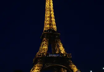 This photo was taken from a boat on the Seine, we'd gone on a river tour and as the trip ended and we came around the bend we saw the Eiffel tower all lit up.