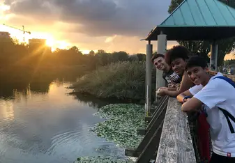 Three International Students Enjoy the Evening Sun