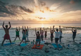 Sunrise yoga on the beach