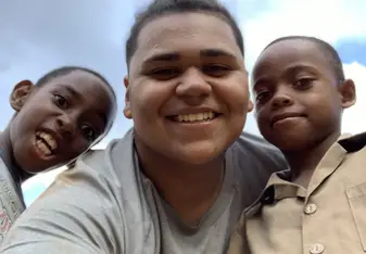 In this photo, it was two of the students from Mt Olivet primary school. They wanted to take a photo with me after i had taught them how to play some baseball. 
