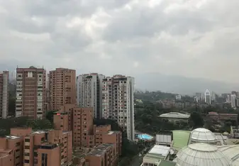 View of my apartment block, the pool, and Santa Fé mall
