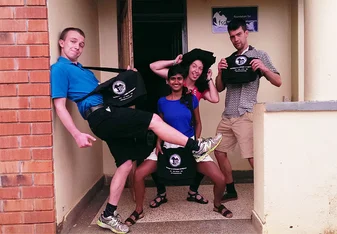 Students take a fun pose outside FSD Uganda Office 