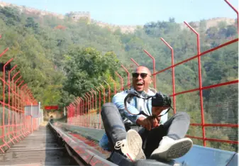 Sliding down the toboggan ride at the Great Wall of China