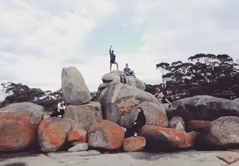 Group picture posing at Bay of Fires in Tasmania 