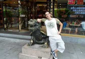 Me standing next to a Tortoise Sculpture, China, 2012.