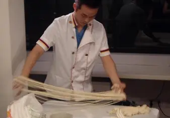 Chef preparing Chinese Noodles, China, 2012.