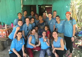 This is a group picture of all of us on the trip on the island with the sweet family that cooked for us after our work every day!