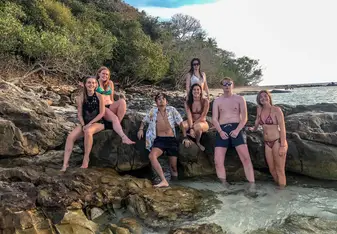 Members of the group at beach during a boat trip around Phi Phi Island