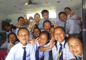 Volunteers and young students in Nepal 