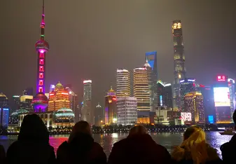shanghai skyline with people from the program