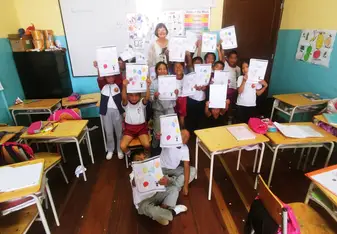 With children in classroom.