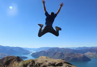 Jumping in the air on Roy’s Peak