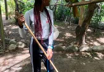 While cleaning the green macaw enclosure, one happened to fly right up to me and my friend was nice enough to capture the moment. 