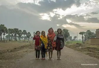 Village families are up working before sun breaks. Farming is the main income source in rural areas. Instead of going to school, children are often asked to stay home for chores or help in the fields.