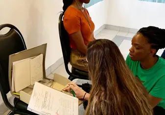Learning how to administer a hearing screening by Dr. Andrews.